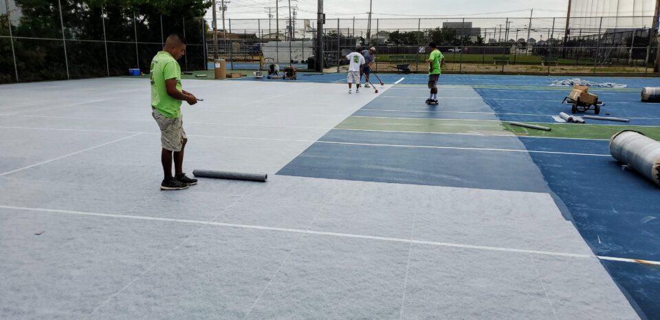 Laying bamalex into reinforced polyester scrim Tennis Court Morgan Hill CA Bay Area