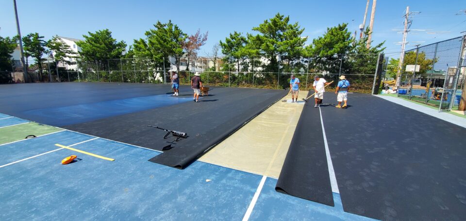 Applying 2 part adhesive, and Rubber Tennis Court Carmel Valley, CA Pro Cushion